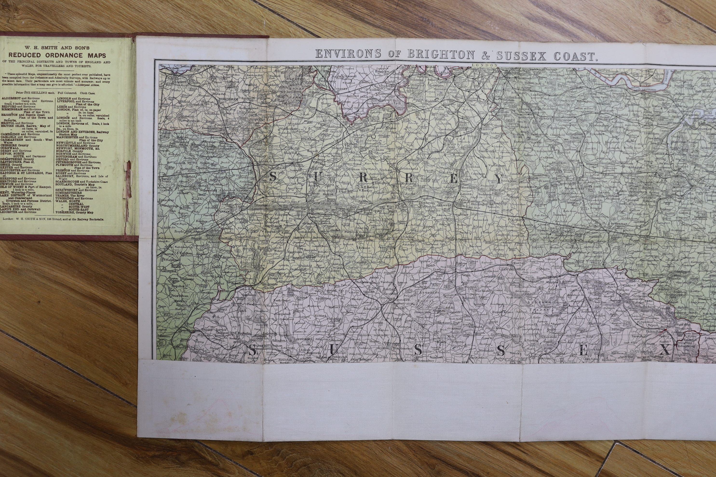 Six 19th and 20th century folding maps of Sussex; an Ordnance Survey (318), a W.H. Smith & Son map, a Smith & Son 172 Strand 1864, two Walker’s County Maps, and a Kelly’s Map